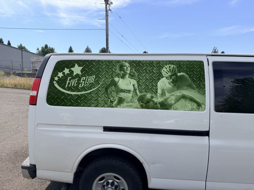 Perforated window graphic on a Five Star passenger van